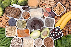 Magnesium food sources, top view on wooden background