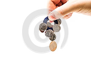 Magnet in a male`s hand attracting money on white background