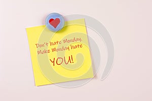 Magnet and yellow sticky note reminder to not hate Monday on refrigerator