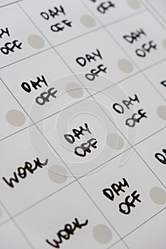 Magnetic board writing 4 day work week calendar with three weekend days off four day working week concept. Modern