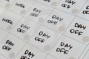 Magnetic board writing 4 day work week calendar with three weekend days off four day working week concept. Modern