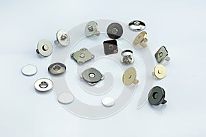 Magnetic buttons for making wallets and backpacks.