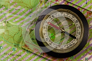 Magnetic compass is located on a topographic map