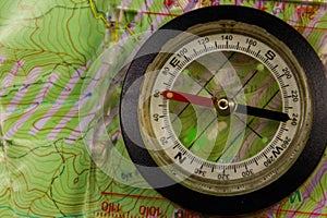 Magnetic compass is located on a topographic map