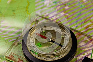 Magnetic compass is located on a topographic map