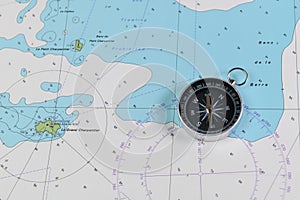 Magnetic compass on a nautical navigational map