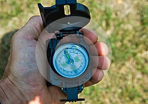 Magnetic compass in the traveler's hand .