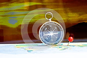 Magnetic compass on a world map conceptual