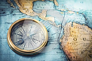 Magnetic compass on world map. Travel, geography, navigation, tou photo