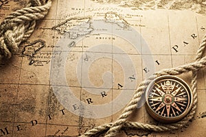 Magnetic compass on world map. Travel, geography, navigation, tourism and exploration concept background. Macro photo