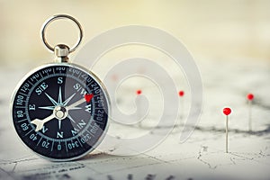 Magnetic compass on world map.Travel, geography, navigation, tourism and exploration concept background. Macro photo. Very