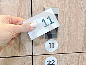 Magnetic locker opening card in the locker room with transponder in form of electronic card