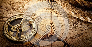 Magnetic old compass on world vintage map 18 century.Travel, geography, navigation, tourism and exploration concept wide