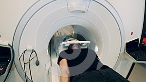 Magnetic resonance tomograph and a patient moving out of it