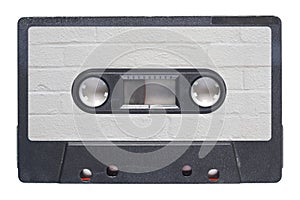 magnetic tape cassette with brick wall label