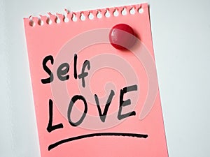 Magnetically attached pink page with inscription Self love.