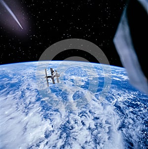 Magnificent earth in outer space. Space station is flying above. The elements of this image furnished by NASA