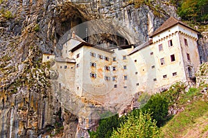 Magnificent landscape of medieval Predjama castle Slovene. Predjamski grad. Castle at the cave mouth.