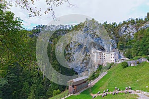 Magnificent landscape of medieval Predjama castle Slovene. Predjamski grad. Castle at the cave mouth. Famous touristic place