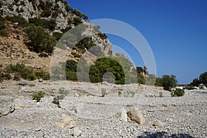 Magnificent mountainous landscape in the vicinity of the parched riverbed of the Loutani river. Kolympia, Rhodes, Greece