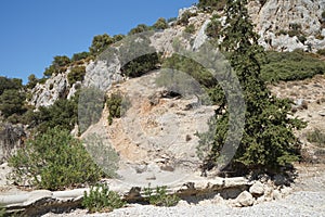 Magnificent mountainous landscape in the vicinity of the parched riverbed of the Loutani river. Kolympia, Rhodes, Greece