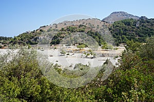 Magnificent mountainous landscape in the vicinity of the parched riverbed of the Loutani river. Kolympia, Rhodes, Greece