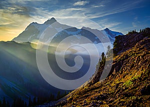 Magnificent Mt Baker in North Cascades Washington at surnise with sun rays