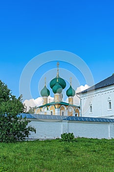 Russia, Uglich, July 2020. An ancient Orthodox church behind the monastery wall.