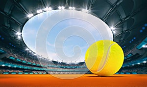 Magnificent outdoor tennis arena with a tennis ball on orange clay with spectators on the grandstand.