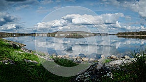 Magnificent panoramic landscape of Lac de l\'Ailette with blue sky and white clouds