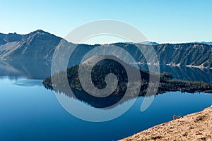 Magnificent reflection of the caldera of Crater Lake in the Crater Lake NP photo