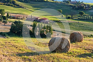 Magnificent spring landscape at sunrise. Beautiful view of typical tuscan farm house