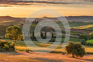 Magnificent spring rural landscape. Stunning view of tuscan green wave hills, amazing sunlight, beautiful golden fields and meadow