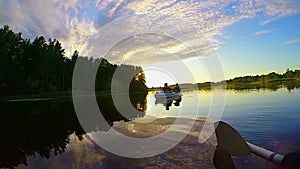 Magnificent sunset on peaceful river, tourists in boat, nature