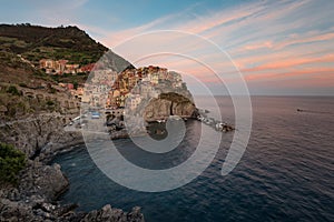 Magnificent sunset view of the Manarola village. Manarola is one of the five famous villages in Cinque Terre Five lands National