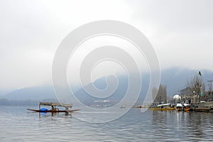 A magnificent view of Kashmir near the lake at Srinagar.A people here using a boat to travel from the other side of lake