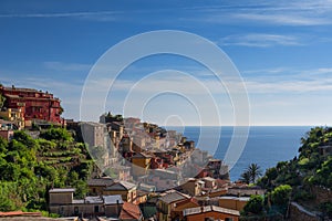 Magnificent daily view of the Manarola village in a sunny summer day. Manarola is one of the five famous villages in Cinque Terre