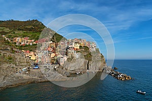 Magnificent daily view of the Manarola village in a sunny summer day. Manarola is one of the five famous villages in Cinque Terre