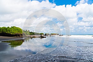 Magnificent view of the sky of palm trees and the shore of a beautiful island, indonesia, bali