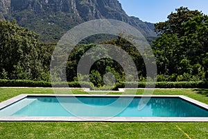 Magnificent view of a swimming pool standing in a garden