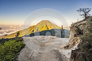 The magnificent views on green mountains from a mountain road trecking to the Ijen volcano or Kawah Ijen on the