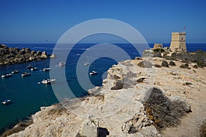 Magnificent views of Riviera Beach and the small watchtower Ghajn Tuffieha Tower, Mellieha, Malta.