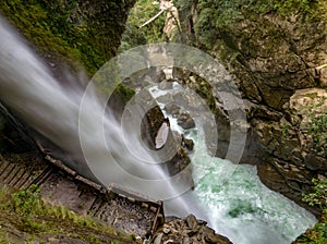 Magnificent waterfall called Pailon del Diablo Devil`s Cauldron in Banos, Ecuador photo