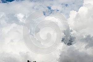 magnificent waves of white clouds against clear blue sky