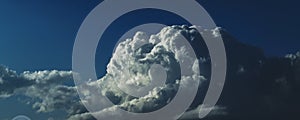 Magnificent white Cumulonimbus cloud in blue sky. Australia.