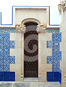 Magnificent wood door in the entrance of a Palace in Catalonia