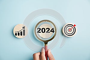 A magnifier focuses on the 2024 icon