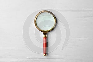 Magnifier glass on white background, top view. Find keywords concept