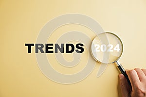 magnifier glasses reveal the words New Year 2024 Trends photo