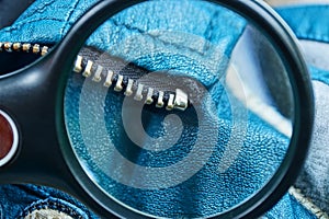 magnifier increases metal zip on blue leather clothes